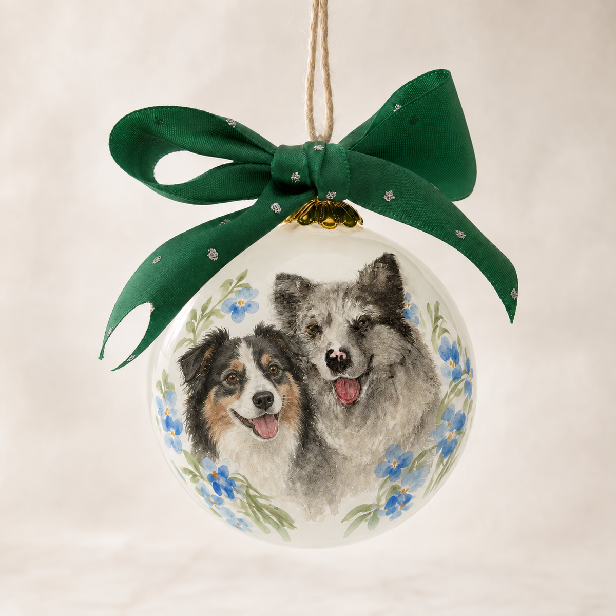 Two-pet inside-painted glass ornament created from separate reference photos