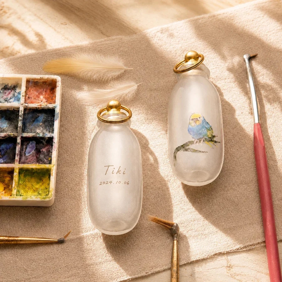 Custom bird feather keepsake with an inside-painted pet portrait