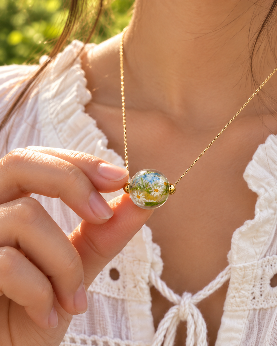 Custom birth flower glass necklace worn on an adjustable chain