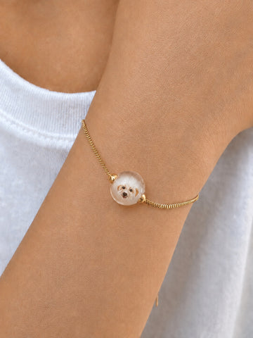 Custom pet portrait bracelet worn by a model