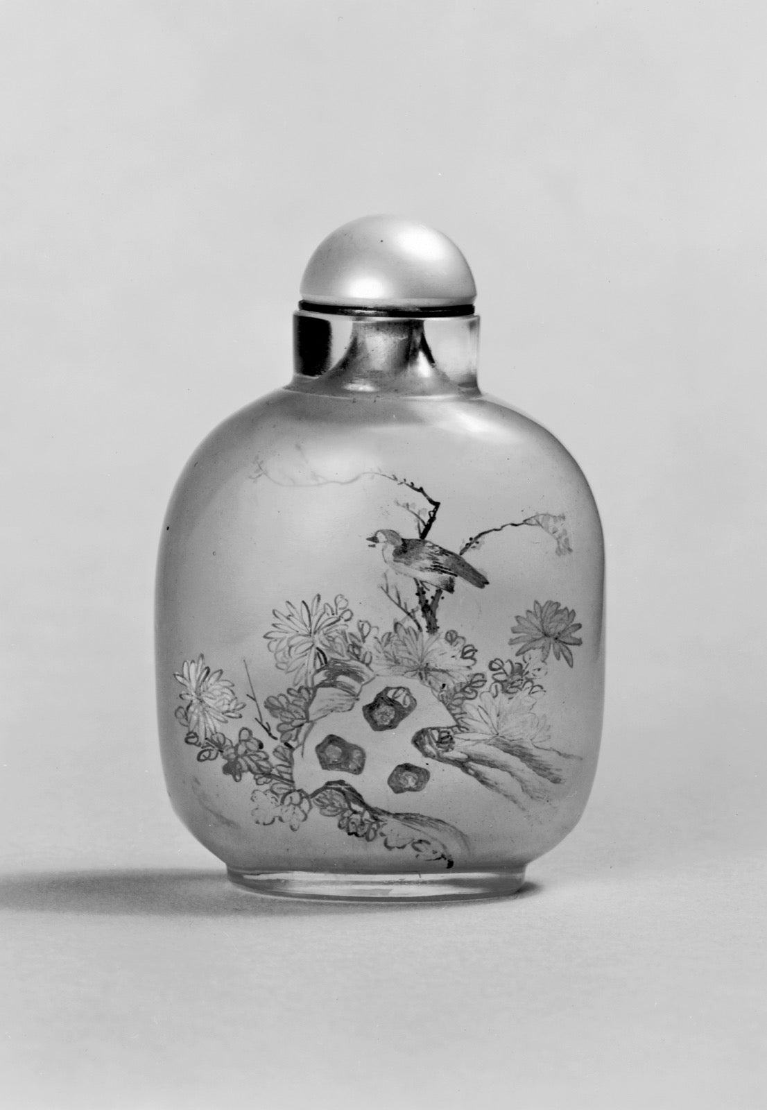 Historic inside-painted glass bottle with birds and flowers