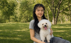 Ally, founder of EVERWITHIN, with her Bichon