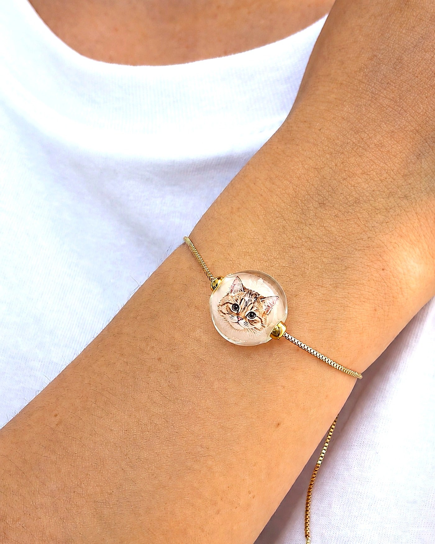Custom cat portrait bracelet detail showing a hand-painted glass bead