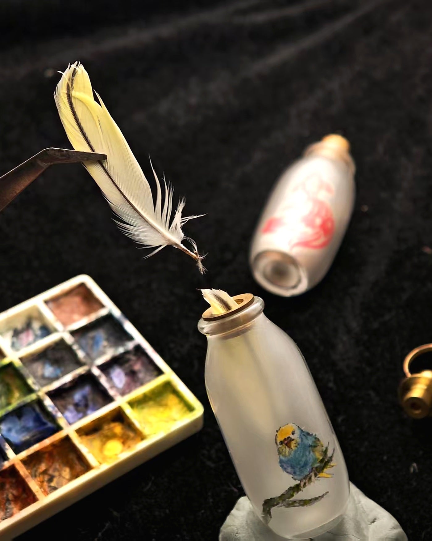 Inside-painting process for a custom feather and fur keepsake vessel
