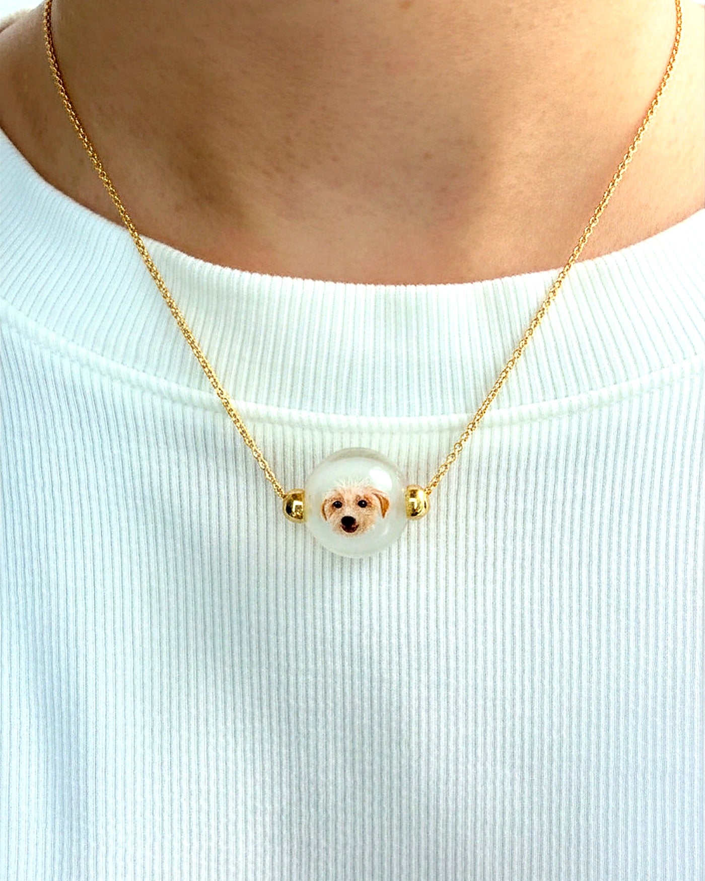 Custom pet portrait necklace worn close to the heart on an adjustable chain